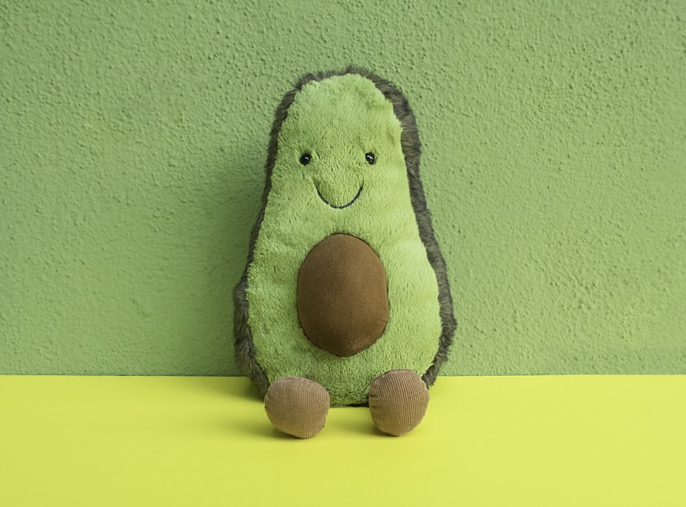 green and black animal plush toy