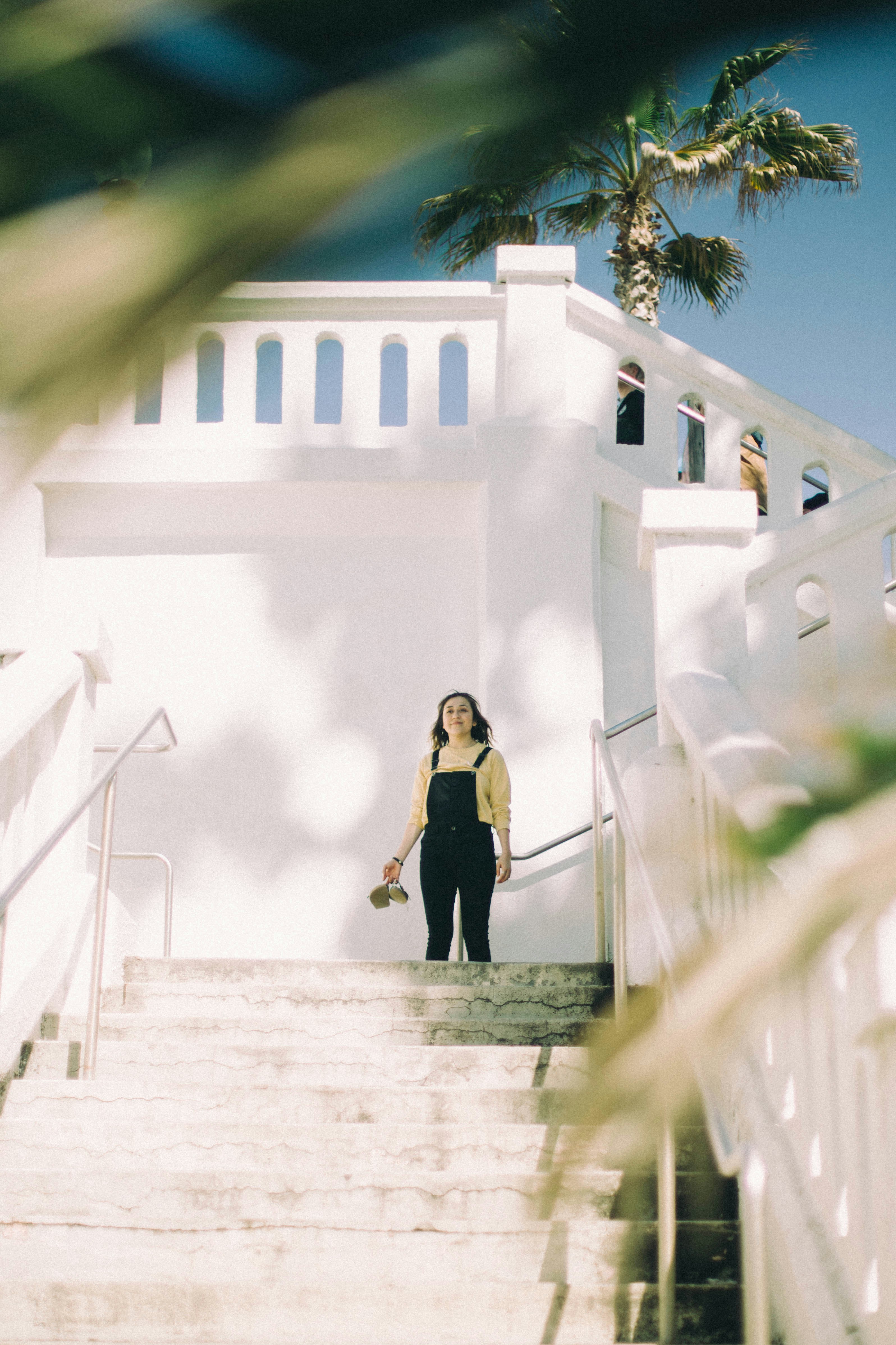 woman standing near stairs during daytime