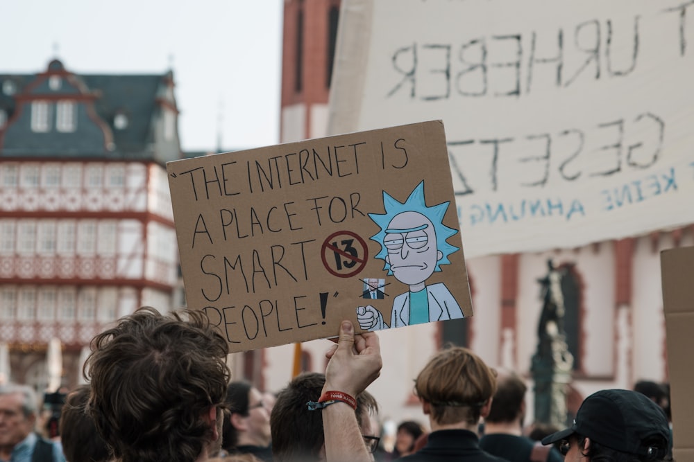 person holding brown banner