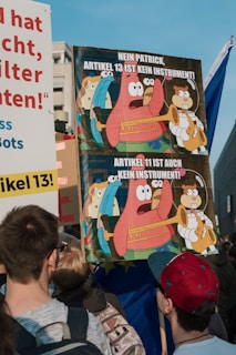 A group of activists holding handmade signs advocating for copyright freedom at a peaceful rally.