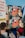 Protesters are gathered, holding signs with cartoons and text regarding Article 13 and Article 11. The visible sign includes a cartoon character holding a trumpet and a message in German related to internet regulations.