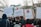 A group of people is participating in a protest, holding signs with messages against Article 13 and automated bots. One sign features binary code and a hashtag declaring 'NO BOTS', while another reads 'ARTIKEL 13' with 'NO UPLOAD FILTER'. A third sign displays a graphic with the text 'YOU SHALL NOT BE PASSED'. The crowd is gathered on a street lined with buildings and trees, and it appears to be daytime.