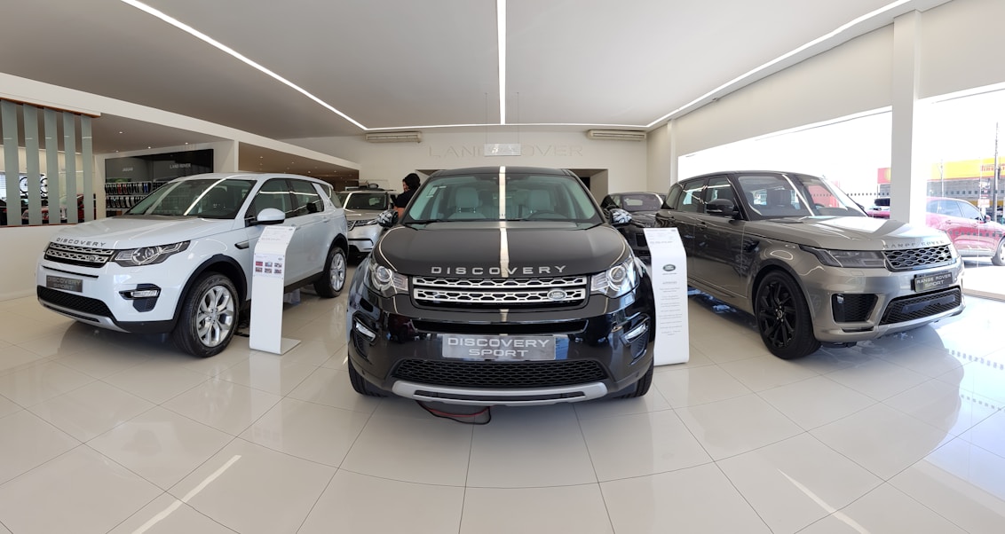 A sleek, modern car showroom featuring various used cars for sale.