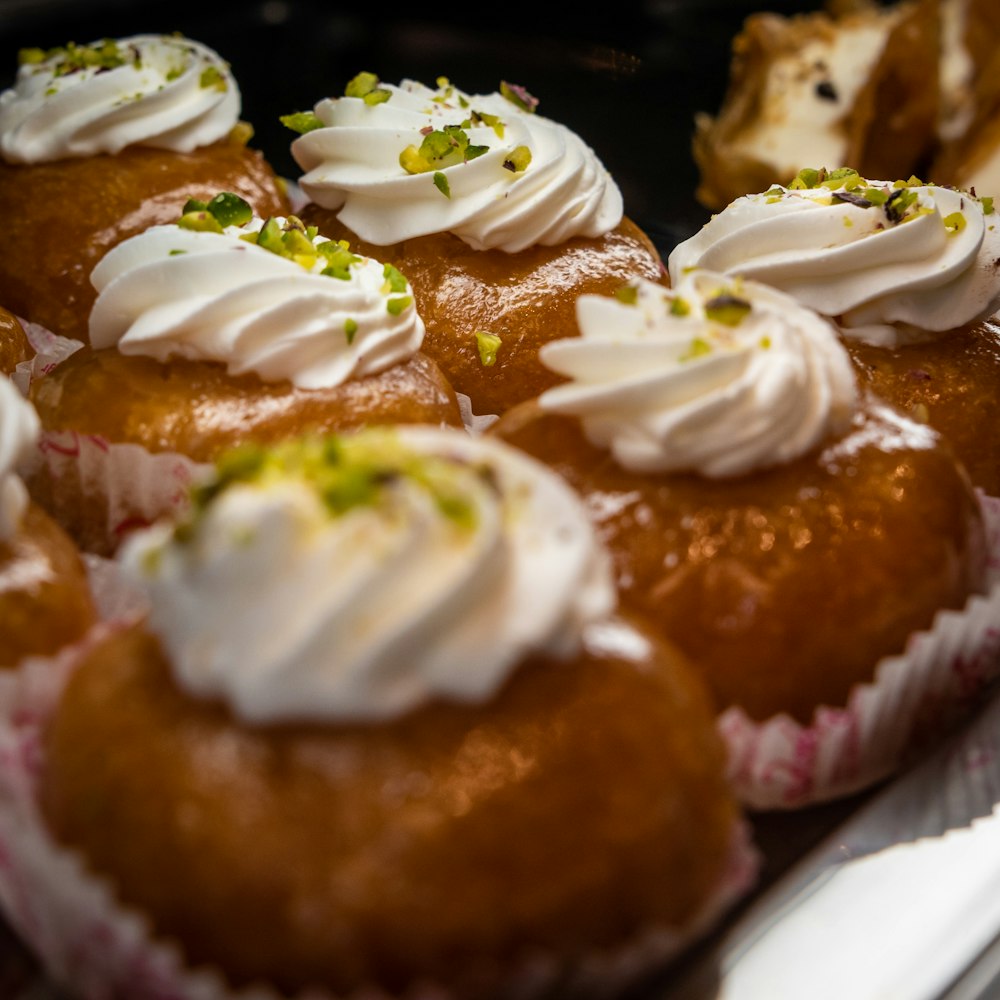 baked cupcakes with white icings