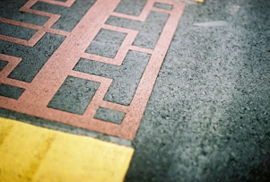 a close up of a red and yellow line on the ground