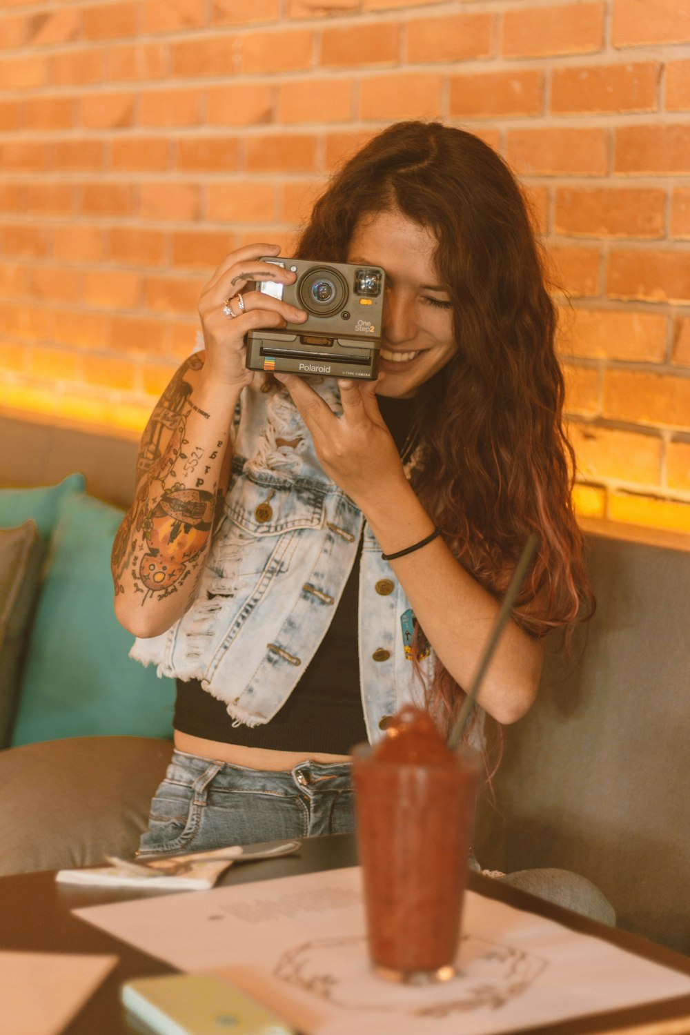 woman holding land camera