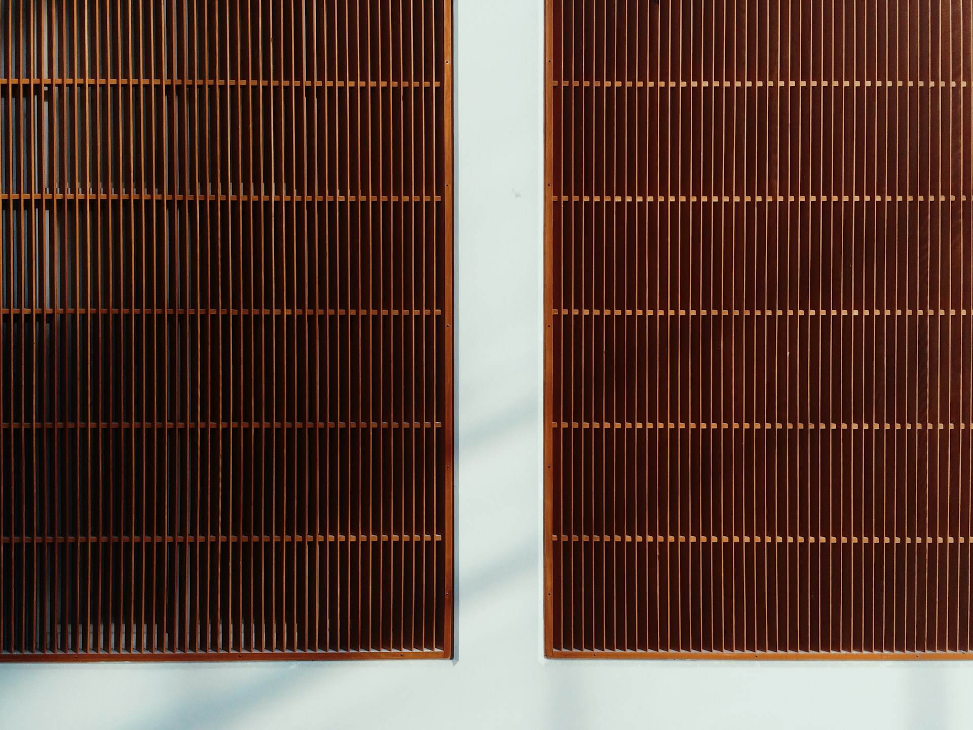 two brown metal grills on wall