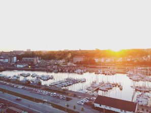 Sunset view over the marina with Joshtek Marine vessels lined up along the pier