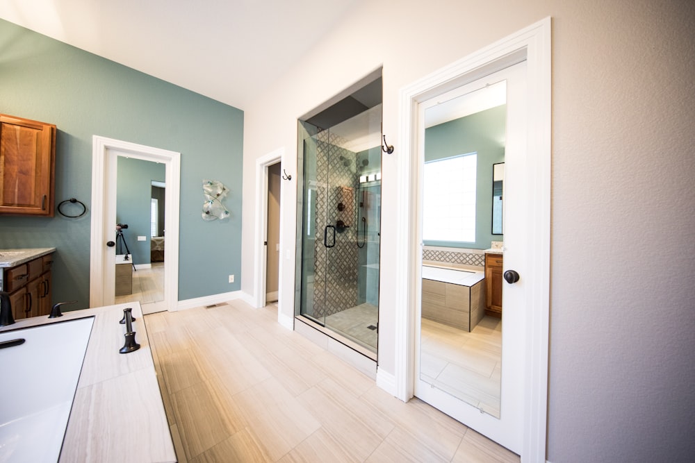 shower stall near white wooden cabinet