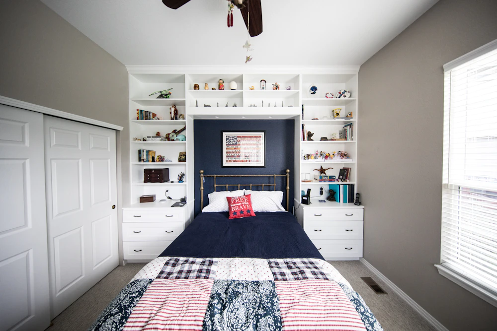 Small plain bedroom with limited storage before renovation