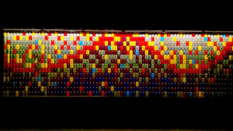A drag-and-drop mosaic wall of colorful thumbnails representing diverse creative niches.