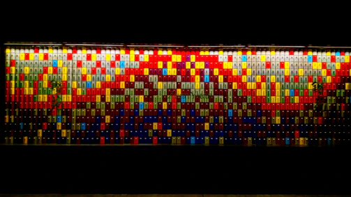 A drag-and-drop mosaic wall of colorful thumbnails representing diverse creative niches.