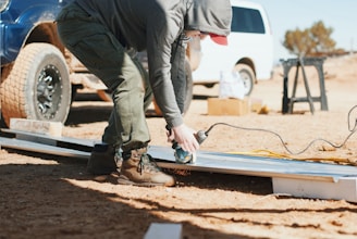 person standing and using angle grinder