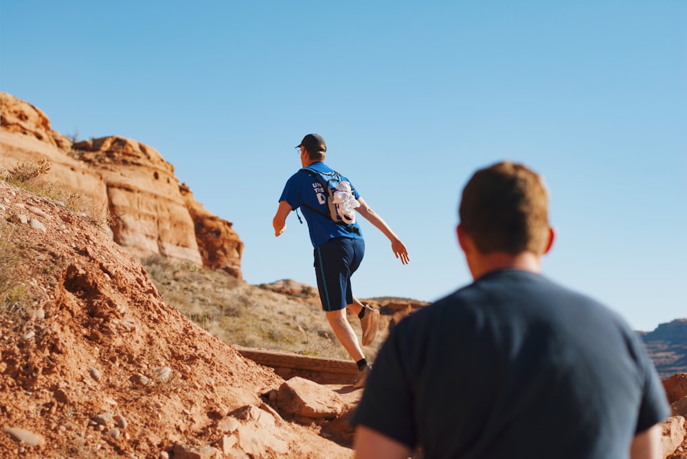 man running on boulder