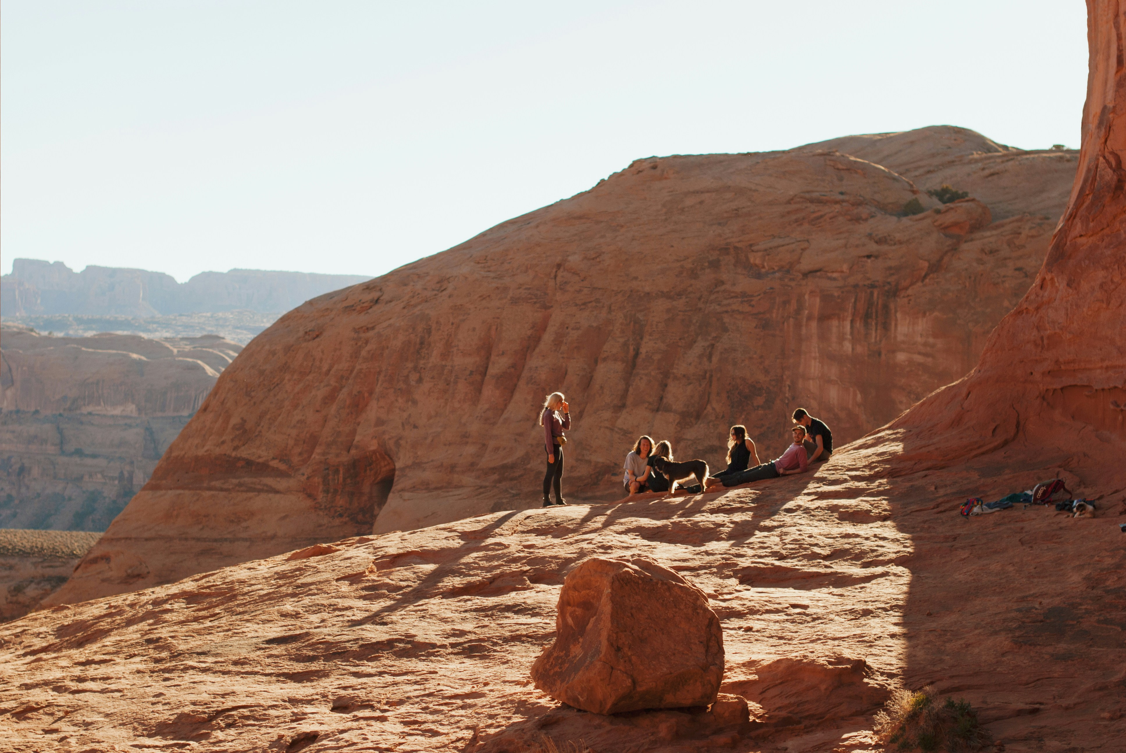 a group of people sitting on top of a mountain