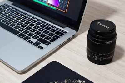 A mouse pad with a bold, custom-printed graphic placed next to a laptop.