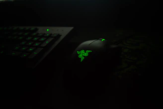 A sleek dark-themed gaming setup with a glowing Steam logo on the monitor.
