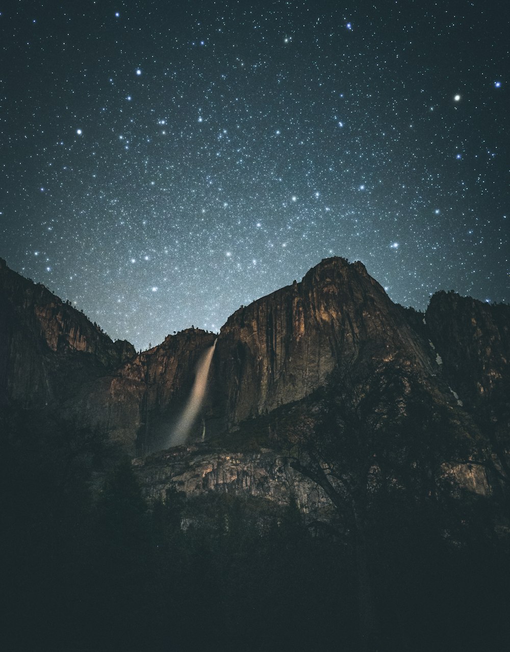 gray mountains at night