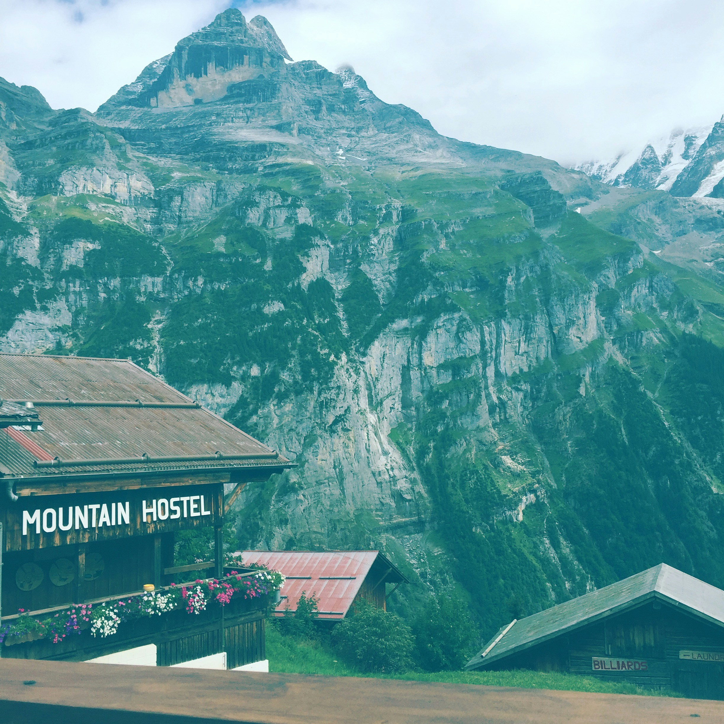 6 Quiet Mountain Getaways That Aren’t Overrun by Tourists – Mountain Hostel near mountains at daytime