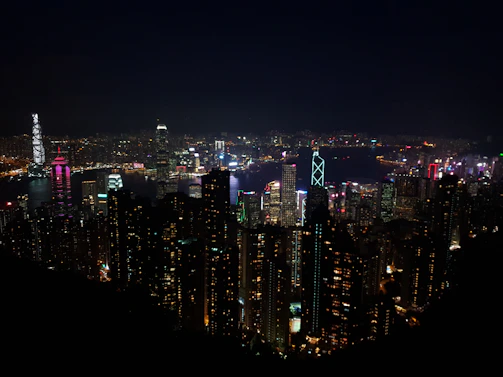 Nighttime cityscape of the Gold Coast skyline sparkling against a deep navy sky.