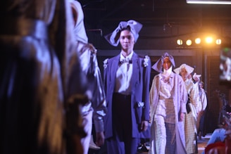 group of women wearing dresses in a fashion show