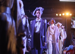 group of women wearing dresses in a fashion show