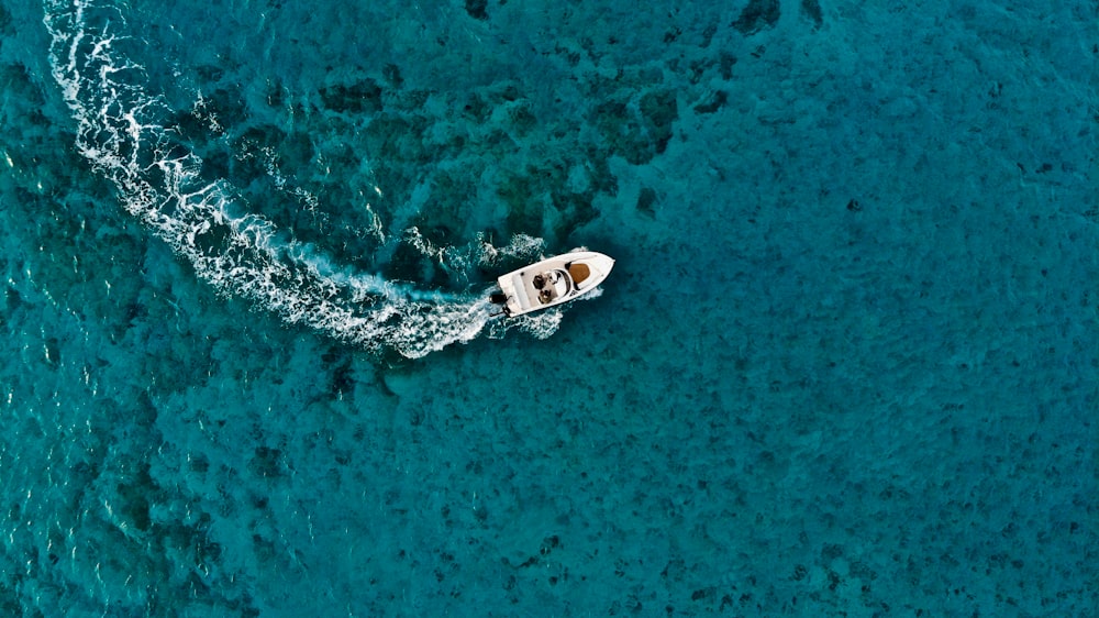 aerial photo of boat on sea during daytime