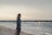 person standing on shoreline