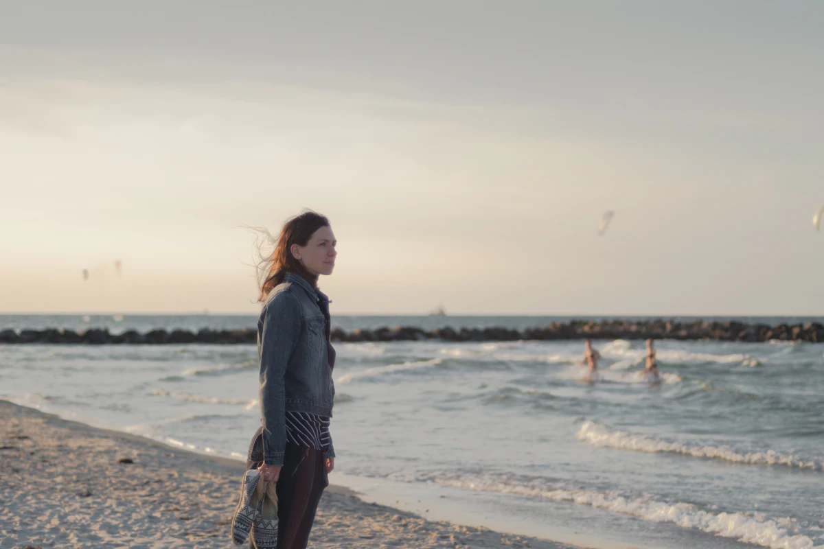Woman in contemplative outdoor setting, representing the inner experience of mood and anxiety conditions