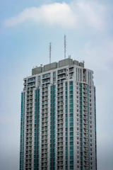 A modern commercial building with visible cellular antenna installations.