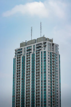 A modern commercial building with visible cellular antenna installations.