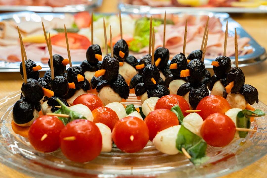 fruits and olives topped cake