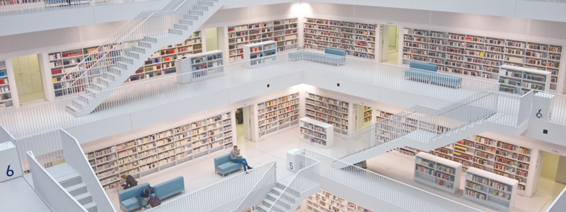 overhead shot of a library with staircases and book stacks