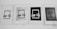 Four printed papers are arranged in a row, each displaying a rectangular design with the text 'SAI' 'COENG' at the top and Chinese characters below. The appearance of each sheet varies, with different levels of contrast and background patterns.