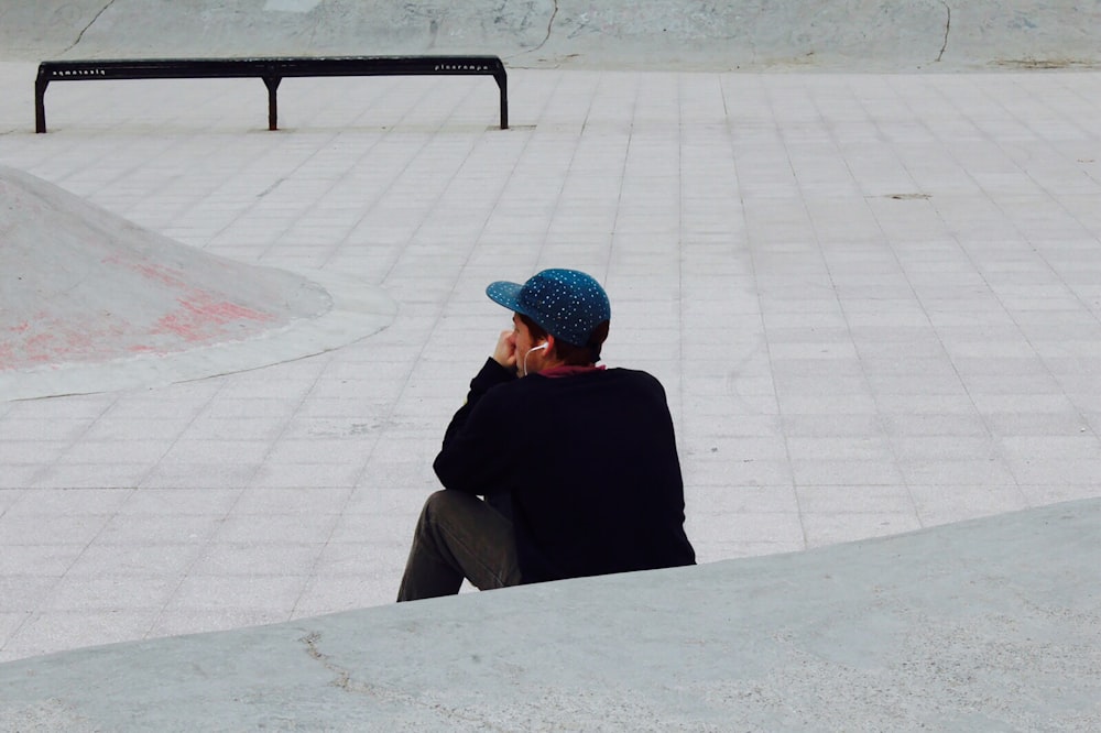 man in black sweater sitting