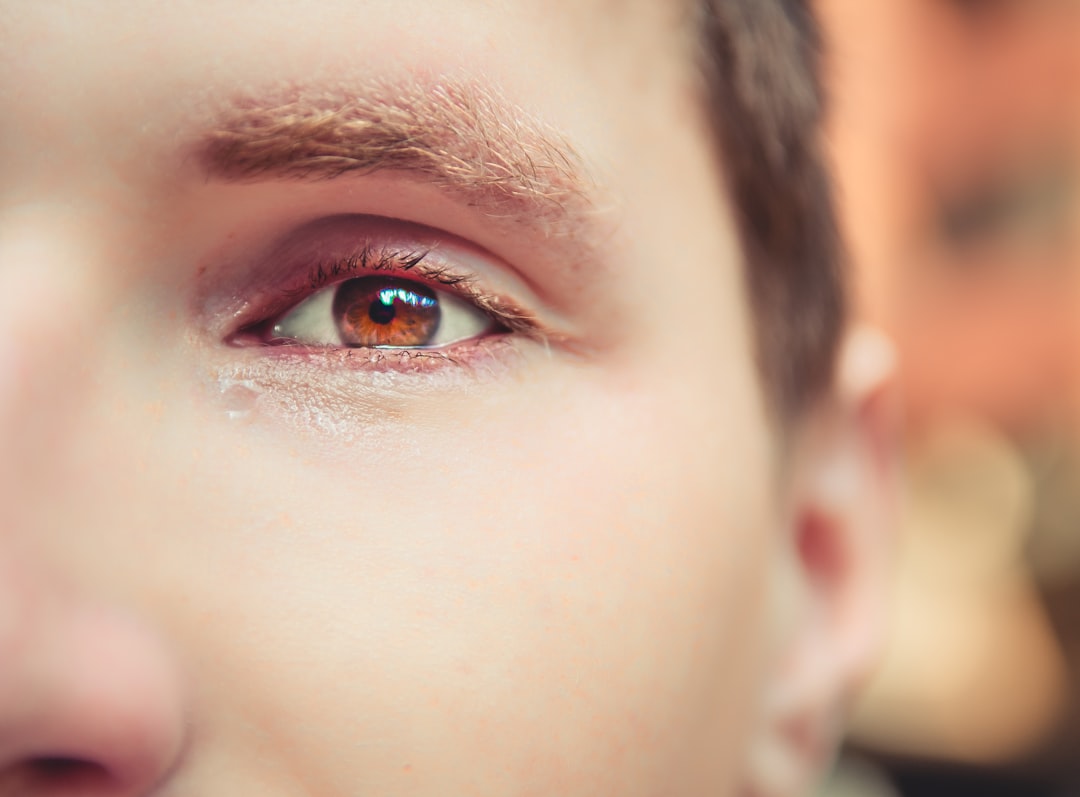 close-up photography of man crying