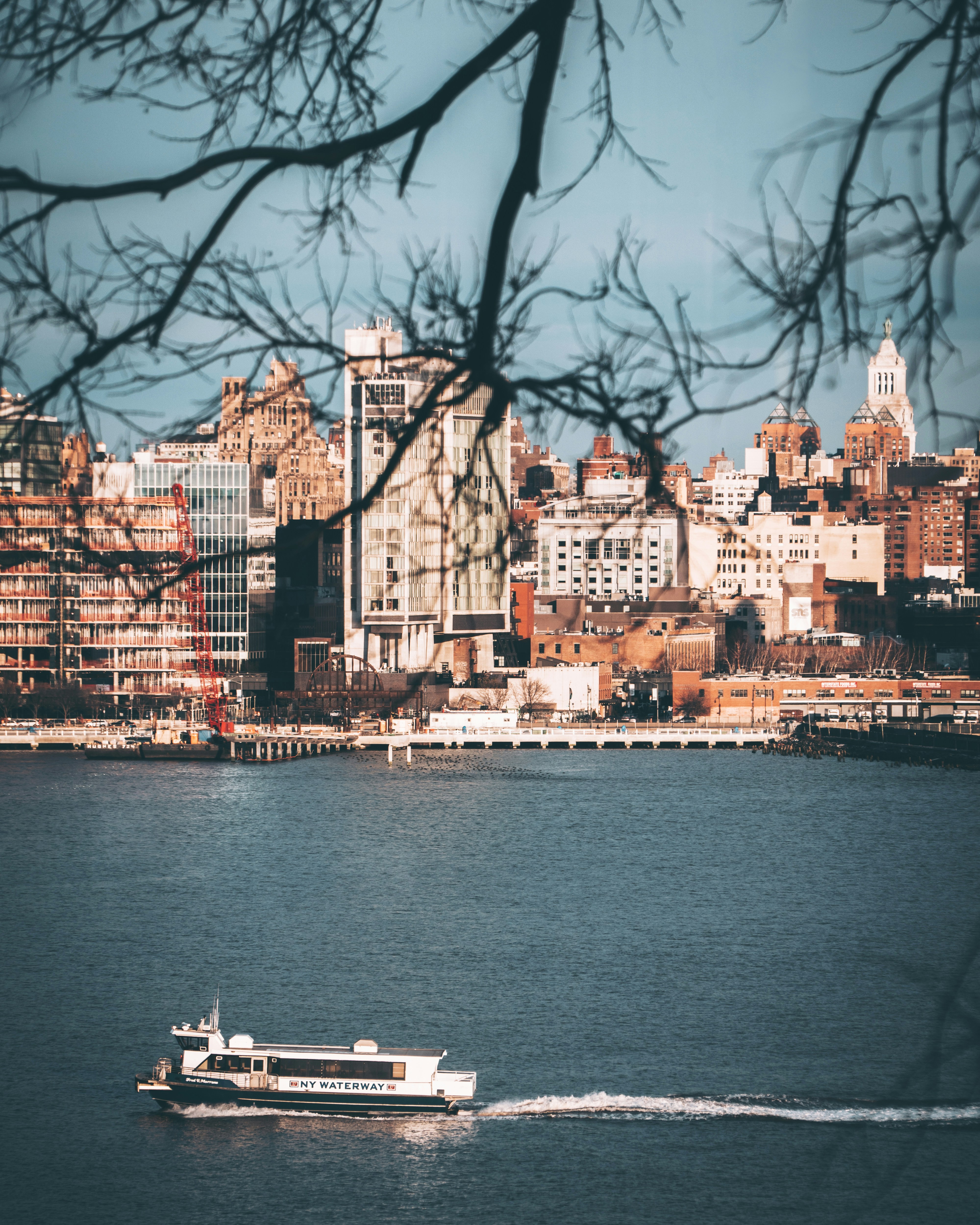 white sail boat near building