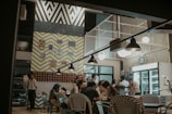 A diverse group of people sharing opinions over coffee in a cozy café.