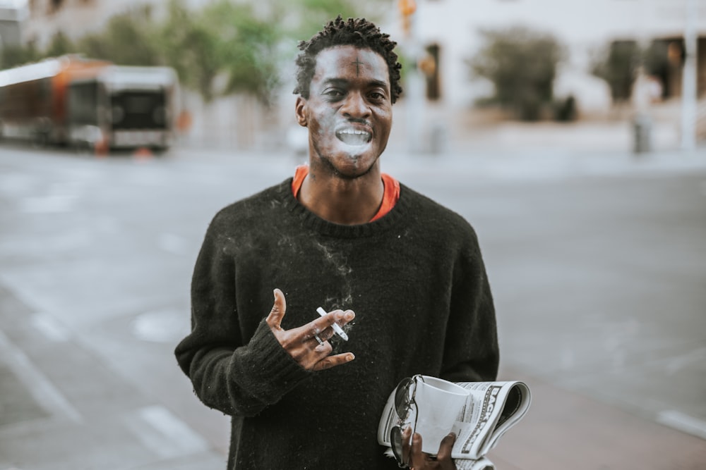 man with cigarette on hand