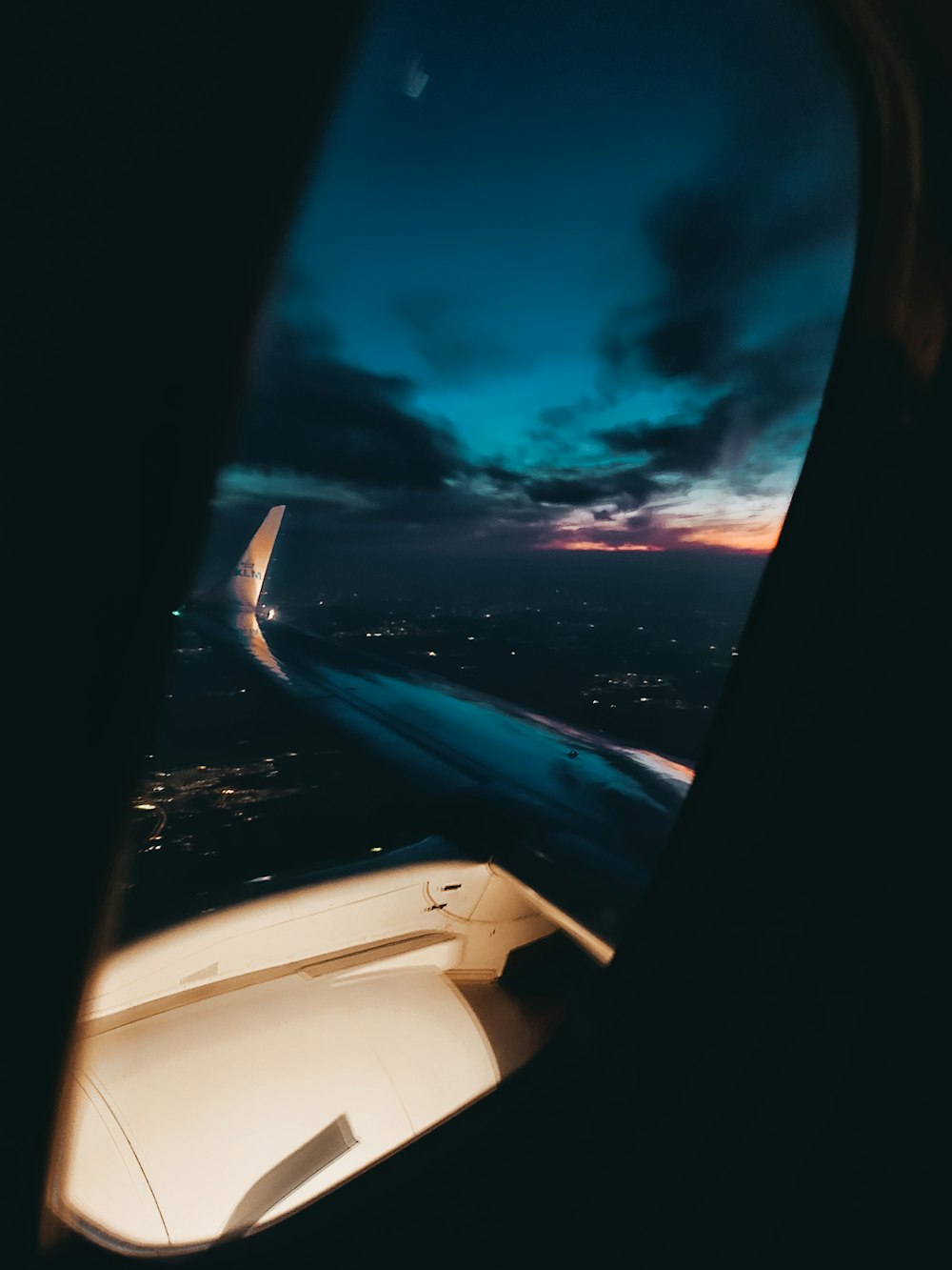 airplane window view of clouds during daytime