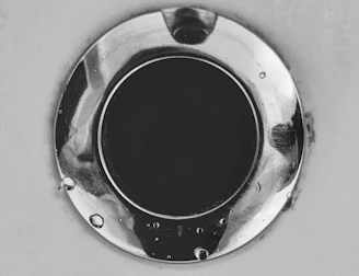 Close-up of a plumber clearing a clogged drain with specialized equipment.