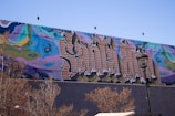An inspiring mural depicting themes of mental health and wellness.