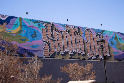 A vibrant street mural bursting with colors, shown as a crisp Instagram-sized photo.