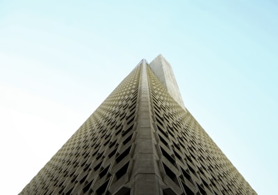 low-angle photography of beige high-rise building