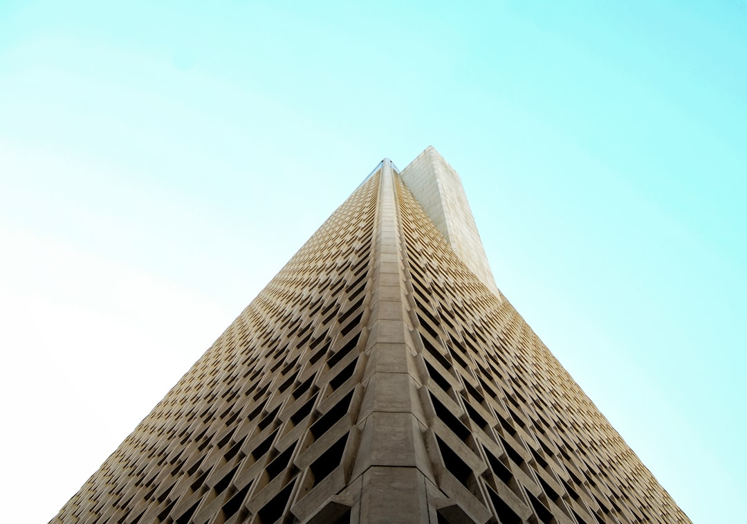 low-angle photography of beige high-rise building,