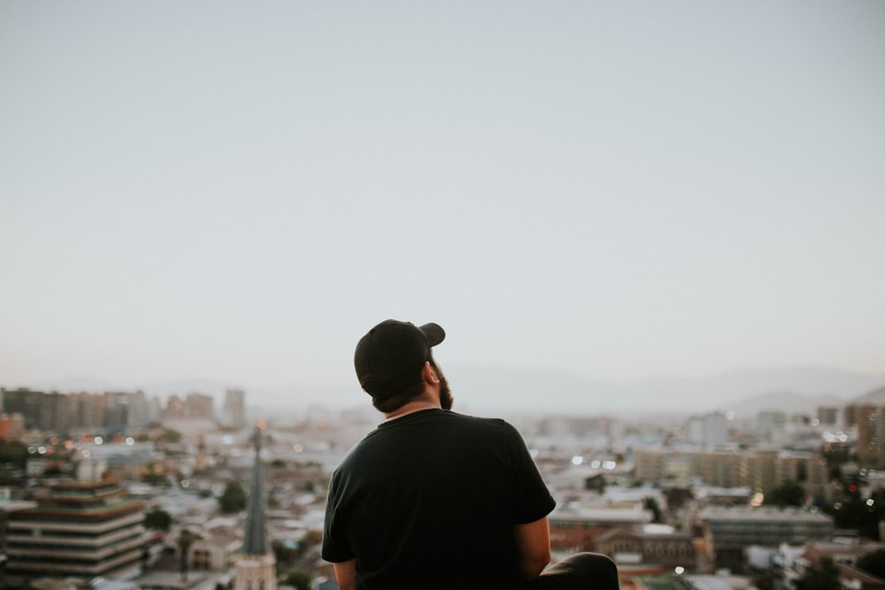 man wearing black baseball cap