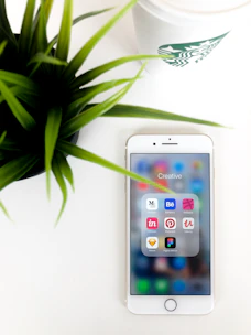 A creative prompt list for AI tools on a modern smartphone.