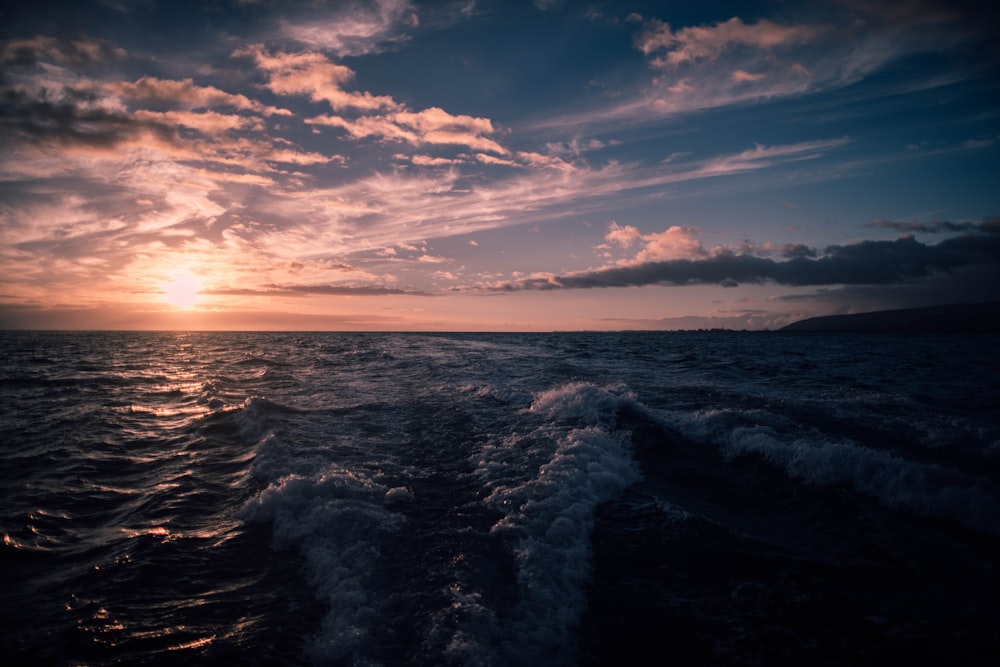 body of water during golden hour