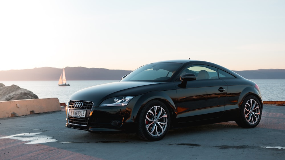 black Audi TT parked in docks