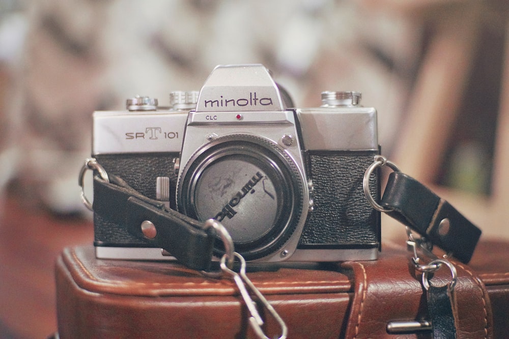 black and gray Minolta camera